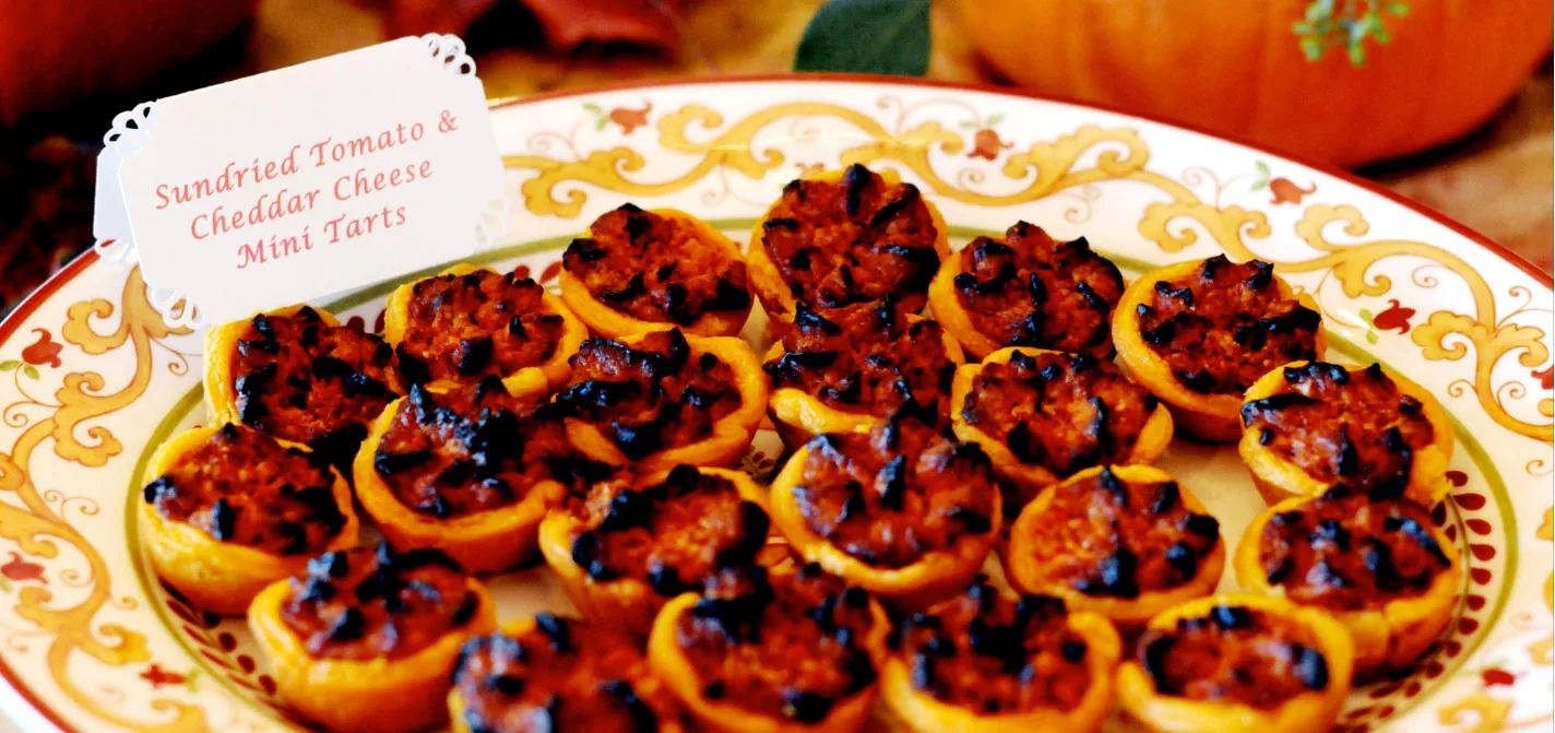 Savory cheddar tarts plated for passed hors d'oeuvres service